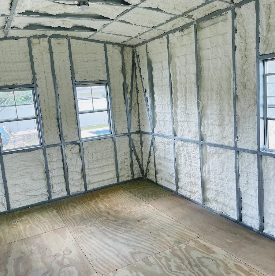 Closed-cell spray foam insulation applied to wall cavities in a residential project in Mont Belvieu